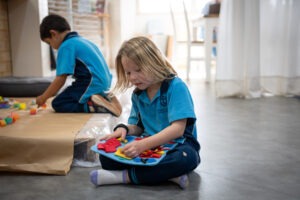 K-2 students engaging with natural materials in the South Coast Baptist College Reggio Emilia atelier.